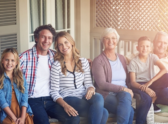 Three generations of family smiling after visiting Santa Clarita dental office