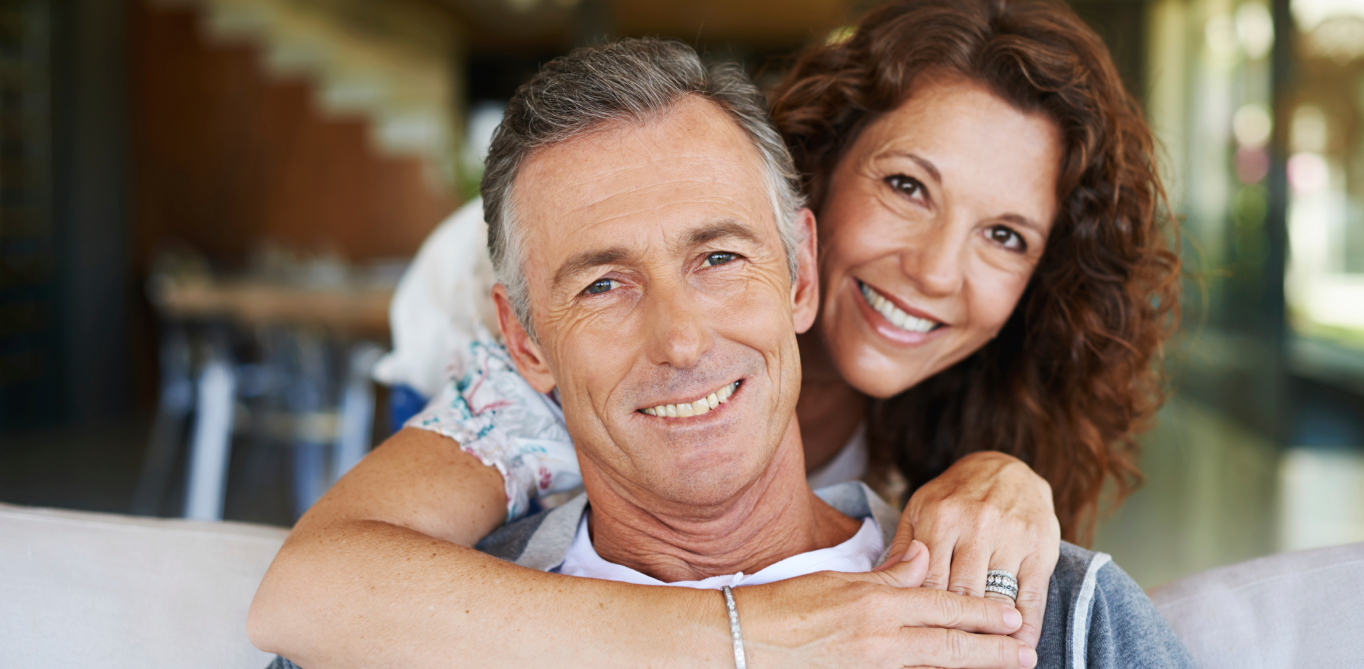 Man and woman smiling together after seeing emergency dentist in Santa Clarita