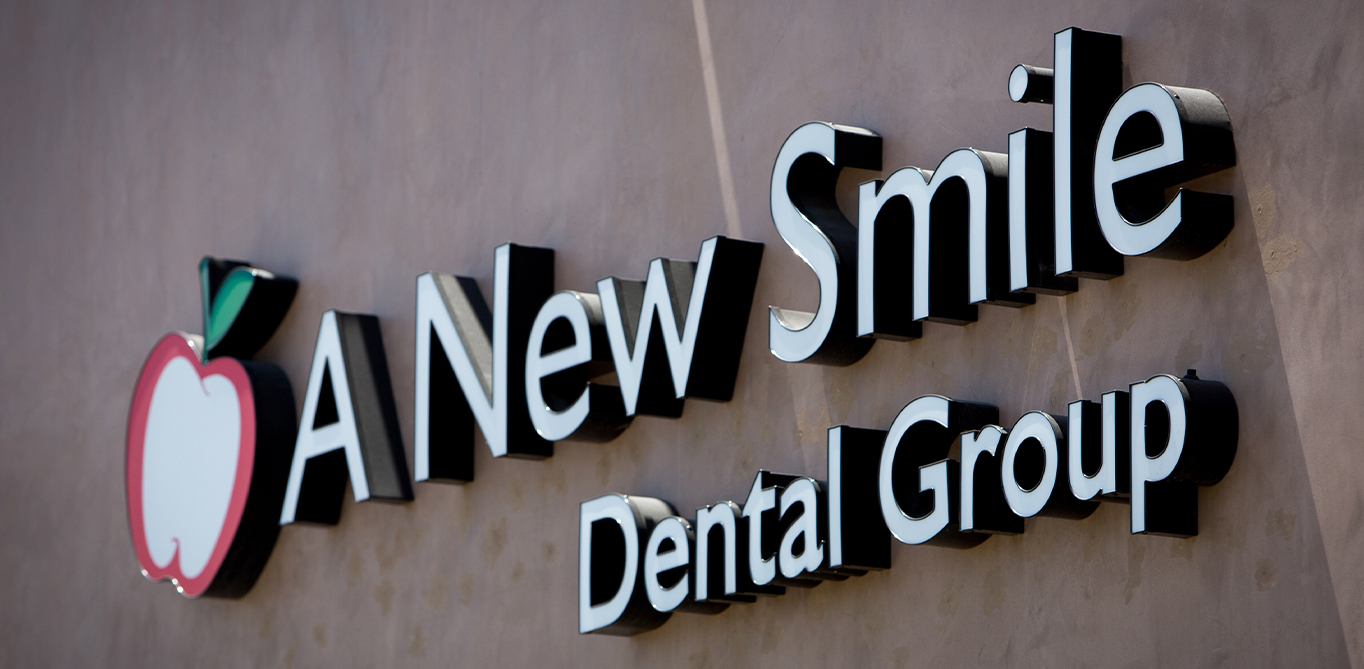 A New Smile Dental Canyon Country sign on outside of Santa Clarita dental office