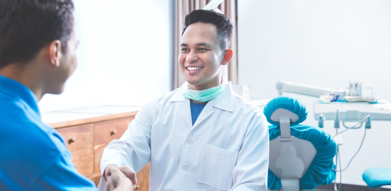 Santa Clarita dentist shaking hands with a dental patient