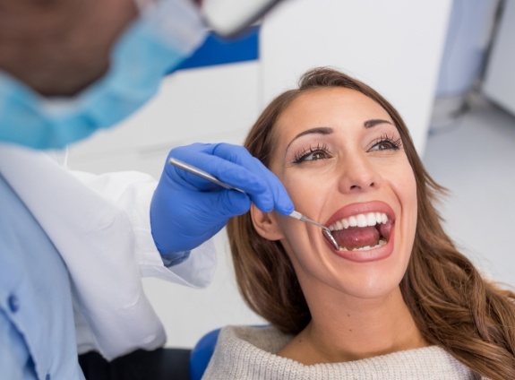 Young woman receiving a preventive dentistry checkup