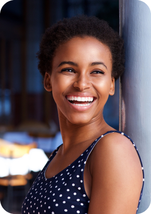 Young woman in sleeveless blouse smiling