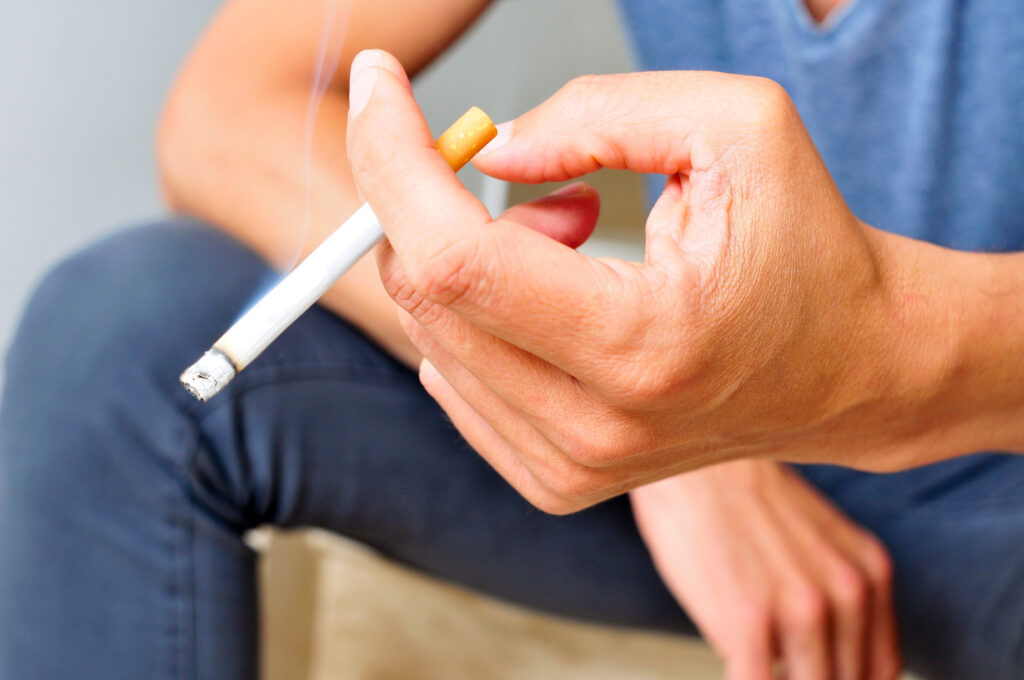 Image of a man smoking a cigarette