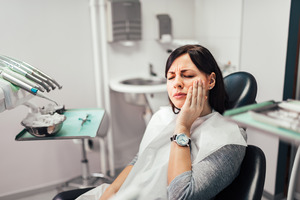 Woman in dental chair with toothache